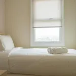 Compact 2BR with Sofa Bed at Parahyangan Residence By Travelio